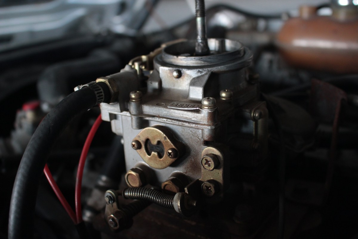 A close-up of a car carburetor