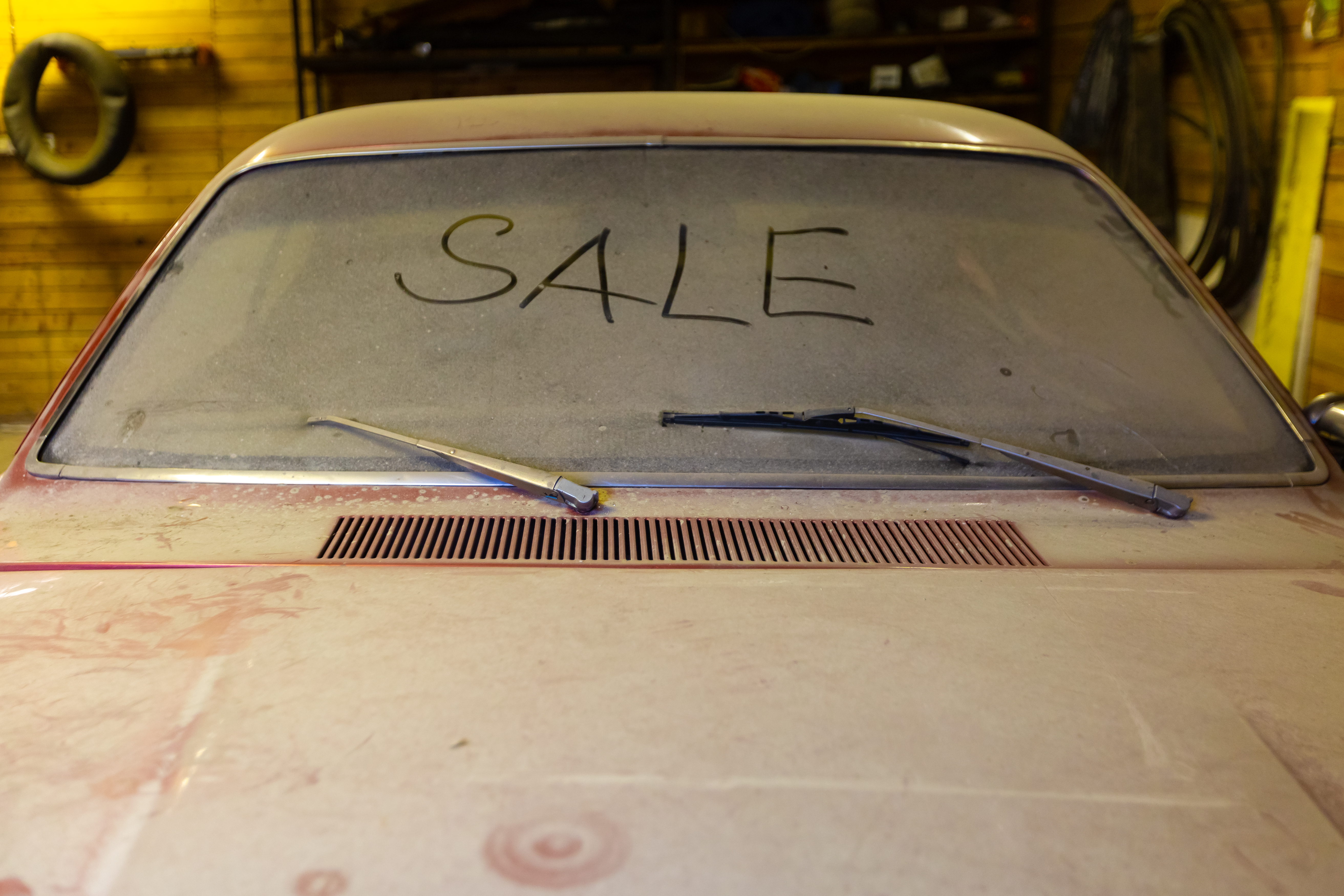 View,Of,Old,Car,In,Garage,With,Dusty,Hood,Dirty