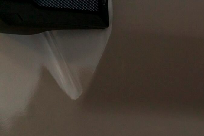 Vista trasera de una SUV Toyota TRD Pro en un entorno natural, con luz trasera encendida.