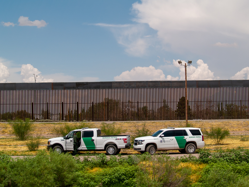 Border Patrol and El Paso Texas police guard the body of a man who was found dead inside the Rio Grande.