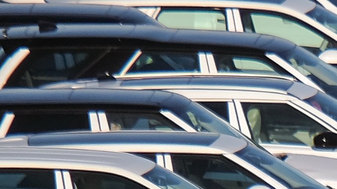 International trade concept: Numerous brand new cars are waiting to be transported