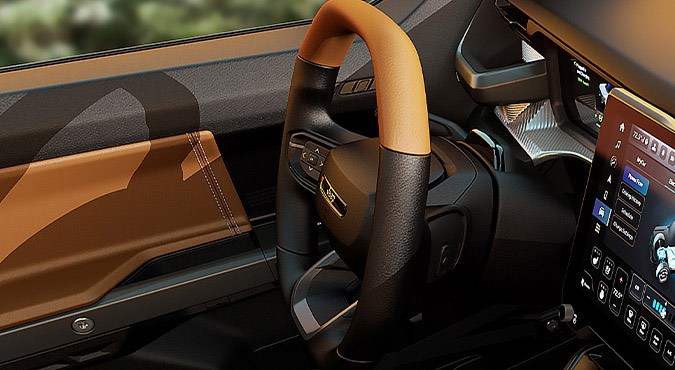 Interior del Jeep Recon 2026 con pantalla táctil, volante multifunción y acabados premium enfocados en confort, tecnología y equipamiento avanzado.