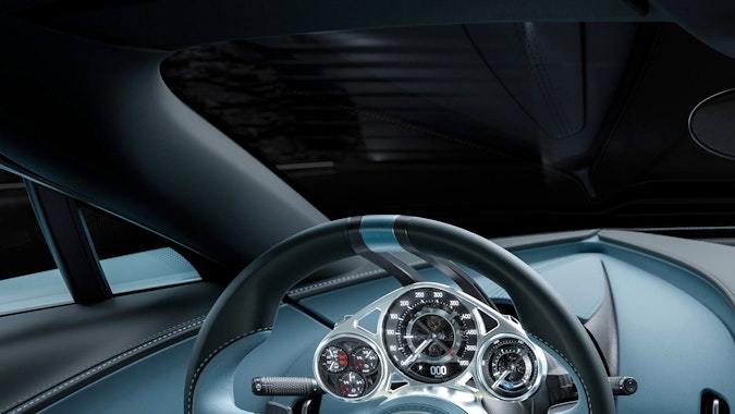 Vista exterior frontal cenital Bugatti Tourbillon azul, hiperdeportivo de lujo, diseño aerodinámico y exclusivo, considerado uno de los autos más caros del mundo.