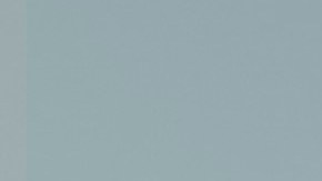 Honda Prologue Elite 2024 turquesa en carretera montañosa al atardecer, SUV eléctrico premium con equipaje, perfecto para exploración sostenible.