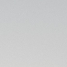 Hyundai Palisade 2025 negro en movimiento por desierto, SUV familiar tres filas potente con rines grandes y diseño robusto.