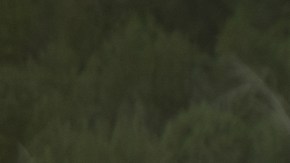 Toyota Corolla Cross XLE AWD 2026 rojo cristal perfil lateral en paisaje árido, crossover Toyota 2026 importación legal.