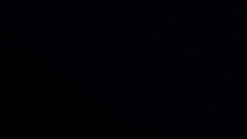 Acura RDX 2026 teaser lateral, silueta moderna con luces LED en fondo negro.