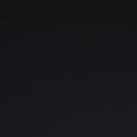 Perfil lateral Nissan Z Nismo: Perfil del Nissan Z Nismo 2027 en gris con faldones laterales y rines deportivos.