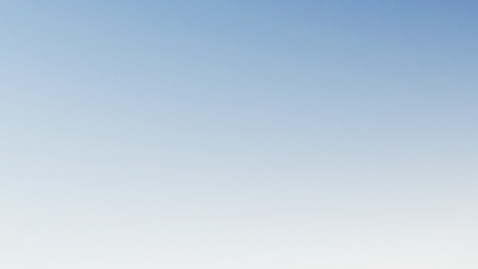 Vista del Genesis X Skorpio Concept en el desierto, con carrocería naranja, enormes neumáticos off-road, difusor y luces continuas para conducción extrema.