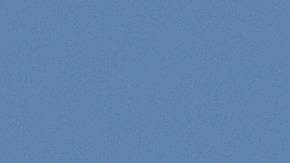 Hyundai Palisade híbrido 2026 en movimiento por autopista soleada, diseño robusto y eficiente.