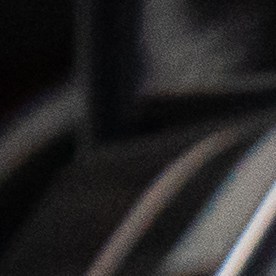 Detalle de las luces traseras LED del Mitsubishi Outlander 2026 en color gris, diseño moderno de SUV híbrido enchufable orientado a la eficiencia urbana