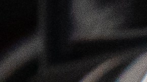 Detalle de las luces traseras LED del Mitsubishi Outlander 2026 en color gris, diseño moderno de SUV híbrido enchufable orientado a la eficiencia urbana