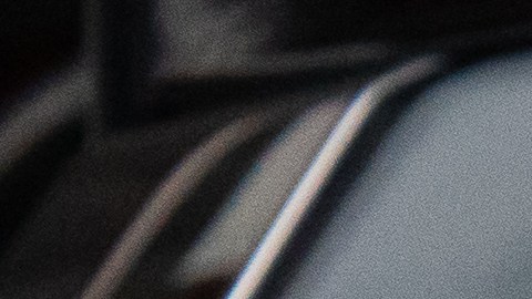 Detalle de las luces traseras LED del Mitsubishi Outlander 2026 en color gris, diseño moderno de SUV híbrido enchufable orientado a la eficiencia urbana