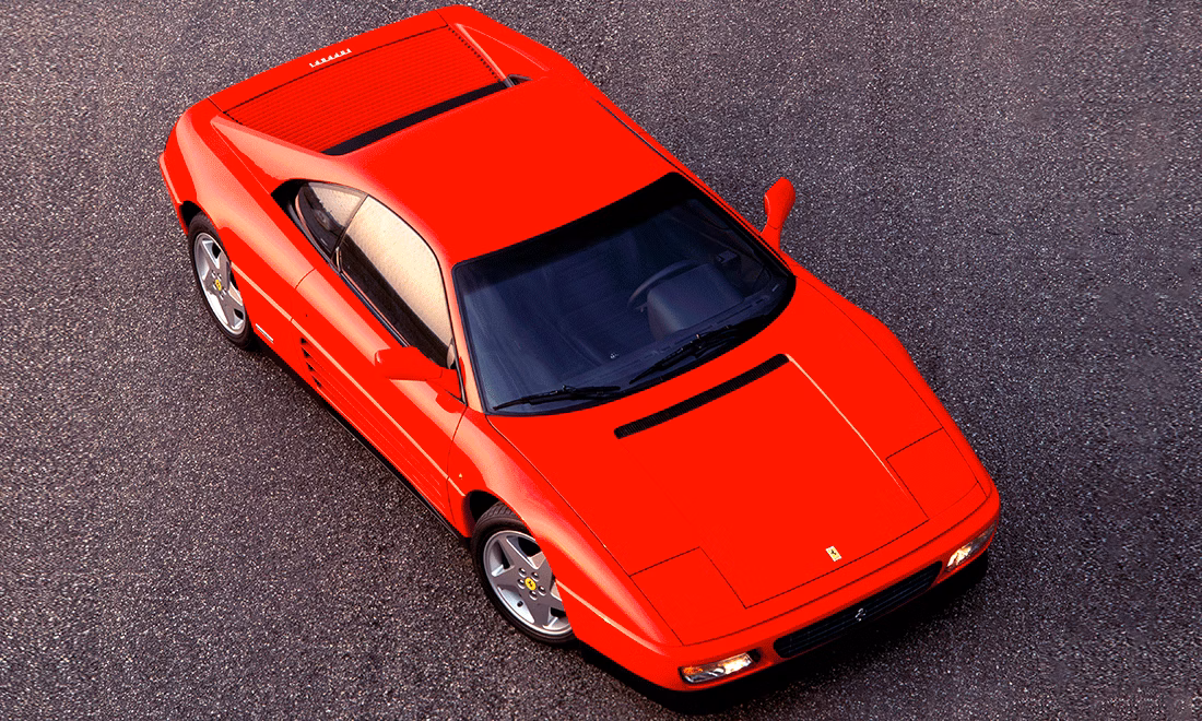 Ferrari 348 rojo visto desde arriba, deportivo clásico italiano con carrocería wedge y estilo Ferrari noventero
