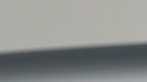 Detalle trasero del BMW iX: piloto LED horizontal, logo iX y emblema BMW en acabado premium.