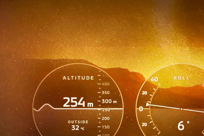 Cuadro de instrumentos digital Mitsubishi Pajero con medidores de altitud, inclinación y temperatura en ambiente off-road épico.