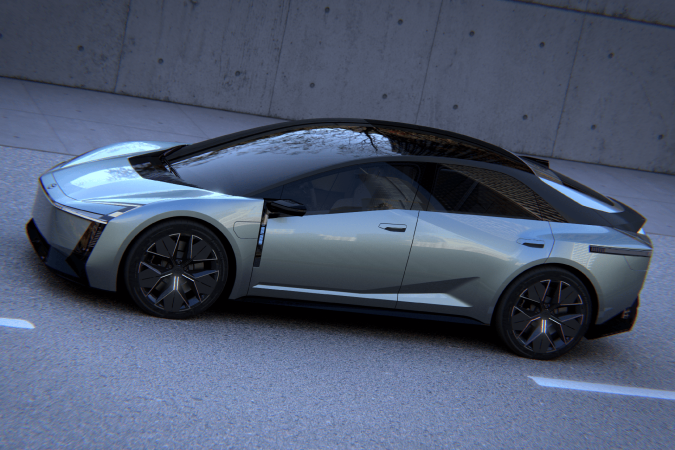 Concepto Toyota Corolla futurista plateado con techo negro y diseño aerodinámico en entorno urbano moderno.